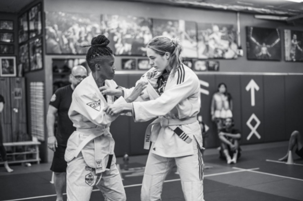 Two women competing in combat sports and martial arts